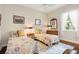 Comfortable bedroom with two twin beds, colorful quilts, and matching nightstands at 793 Vanderbilt Dr, Nokomis, FL 34275