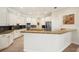 Spacious kitchen with granite counters and white cabinets at 793 Vanderbilt Dr, Nokomis, FL 34275