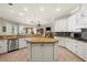 Spacious kitchen with an island, stainless appliances, granite countertops, and an open view to living areas at 793 Vanderbilt Dr, Nokomis, FL 34275