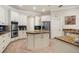 Gourmet kitchen with custom cabinetry, granite countertops, stainless steel appliances, and a central island at 793 Vanderbilt Dr, Nokomis, FL 34275