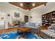 Cozy living room featuring a fireplace, wood floors, and a striking blue rug at 793 Vanderbilt Dr, Nokomis, FL 34275