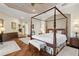 Main bedroom with hardwood floors, a large bed, and plenty of space for furniture at 793 Vanderbilt Dr, Nokomis, FL 34275