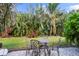 Charming patio with table and chairs, perfect for outdoor dining at 793 Vanderbilt Dr, Nokomis, FL 34275