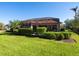 Screened lanai and lush landscaping surrounding the pool at 804 Amaryllis Ln, Venice, FL 34292