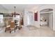 Bright dining area with wicker chairs and glass top table at 819 Shadow Bay Way, Osprey, FL 34229