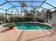 Screened pool and patio with plenty of space for relaxing and entertaining at 819 Shadow Bay Way, Osprey, FL 34229