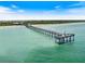 Aerial view of a pier extending over the ocean at 842 Nokomis S Ave, Venice, FL 34285
