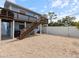 Gravel backyard with elevated deck and stairs at 842 Nokomis S Ave, Venice, FL 34285