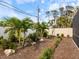 Landscaped backyard with tropical plants and mulch at 842 Nokomis S Ave, Venice, FL 34285
