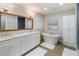 Luxurious bathroom featuring dual sinks, soaking tub, and contemporary finishes at 842 Nokomis S Ave, Venice, FL 34285