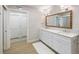 Stylish bathroom with double vanity, decorative mirror, and modern fixtures at 842 Nokomis S Ave, Venice, FL 34285