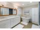 Elegant bathroom with a free-standing tub and double vanity at 842 Nokomis S Ave, Venice, FL 34285