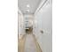Light hallway with wood flooring and access to bedroom and closets at 842 Nokomis S Ave, Venice, FL 34285