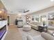 Spacious living room with hardwood floors, light walls and large windows at 842 Nokomis S Ave, Venice, FL 34285