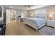 Main bedroom with king bed, sitting area, and ample natural light at 842 Nokomis S Ave, Venice, FL 34285