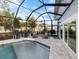 Enclosed pool and patio area with seating at 842 Nokomis S Ave, Venice, FL 34285