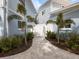 Landscaped side yard with a private gated walkway at 842 Nokomis S Ave, Venice, FL 34285
