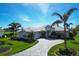 Single-Gathering home with attractive landscaping and paver driveway at 857 Blue Crane Dr, Venice, FL 34285