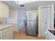 Stainless steel refrigerator in a bright kitchen at 8850 Pickwick Rd, North Port, FL 34287