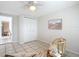 Bright sitting area with built-in shelving and wicker chair at 1050 Olympia Rd, Venice, FL 34293