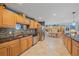 Modern kitchen featuring granite countertops and ample wood cabinetry at 1072 Venetian Pkwy, Venice, FL 34285