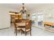 Dining room with chandelier and access to backyard at 108 Park Dr, Osprey, FL 34229