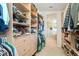 Large walk-in closet with ample shelving and hanging space at 108 Park Dr, Osprey, FL 34229