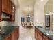 Wet bar with granite countertops and ample cabinetry for storage at 11 Carisa Royale Ct, Englewood, FL 34223