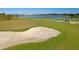 Aerial view of a golf course with lake and sand trap at 12240 Wellen Golf Street # 205, Venice, FL 34293