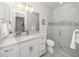 Clean bathroom with white vanity, walk-in shower, and marble details at 124 Colebrook Ct, Venice, FL 34292