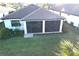 Home with screened patio and landscaped yard at 13097 Rinella St, Venice, FL 34293