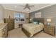 Guest bedroom with a queen bed, large dresser, and ceiling fan at 13097 Rinella St, Venice, FL 34293