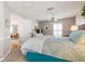 Bedroom with a queen bed and access to hallway at 1333 Whispering Ln, Venice, FL 34285