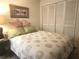 Bedroom with a queen-size bed, and a teal accent wall at 145 Jose Gaspar Dr # 145, Englewood, FL 34223