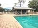 Inviting community pool with a covered patio area, perfect for relaxation and recreation at 145 Jose Gaspar Dr # 145, Englewood, FL 34223