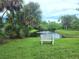 Serene pond with a fountain, offering a tranquil setting for relaxation at 145 Jose Gaspar Dr # 145, Englewood, FL 34223