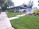 Community pool area with accessible walkways and a well-maintained lawn at 145 Jose Gaspar Dr # 145, Englewood, FL 34223