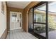 Interior entryway with tiled floor and glass door at 1716 Sklar Ct, Venice, FL 34293