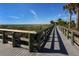 Wooden walkway leading to the beach at 19505 Quesada Ave # Q204, Port Charlotte, FL 33948