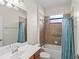 Clean bathroom with a shower/tub combo and updated fixtures at 19874 Benissimo Dr, Venice, FL 34293