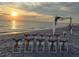 Beach wedding setup with sunset and ocean view at 19874 Benissimo Dr, Venice, FL 34293