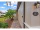 Side view of house showcasing walkway and landscaping at 19874 Benissimo Dr, Venice, FL 34293