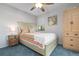 Bright bedroom with a comfortable bed and built-in storage at 2078 Oakridge Cir # A7, Venice, FL 34293