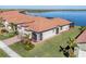 Single-Gathering home with lake view and tropical landscaping at 24176 Spartina Dr, Venice, FL 34293