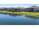 Luxury homes with private lanais and lush landscaping overlooking a peaceful lake at 24176 Spartina Dr, Venice, FL 34293