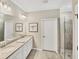 Double vanity bathroom with a large shower at 24176 Spartina Dr, Venice, FL 34293