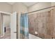 Bathroom with tub and shower, light blue accents at 24176 Spartina Dr, Venice, FL 34293