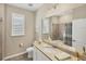 Clean bathroom with shower/tub combo and granite vanity at 24176 Spartina Dr, Venice, FL 34293