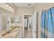 Bathroom with double vanity and access to bedroom at 24176 Spartina Dr, Venice, FL 34293