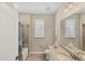 Clean bathroom with shower/tub combo and granite vanity at 24176 Spartina Dr, Venice, FL 34293